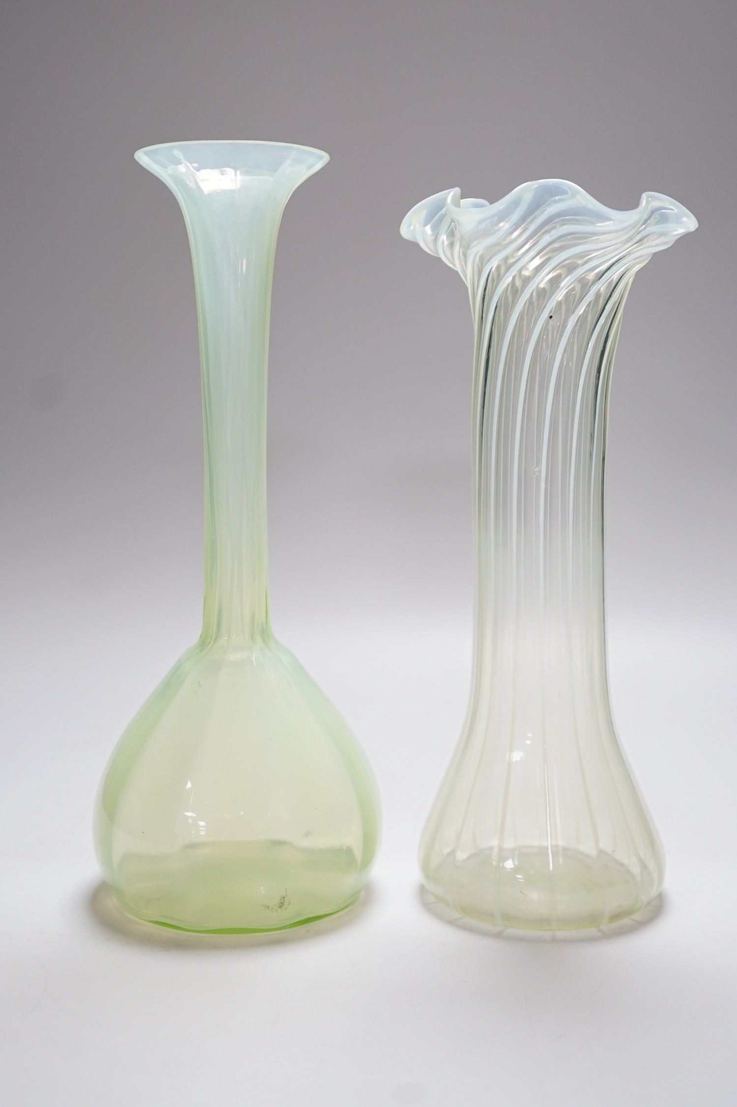 Two Victorian vaseline glass vases, tallest 27cms